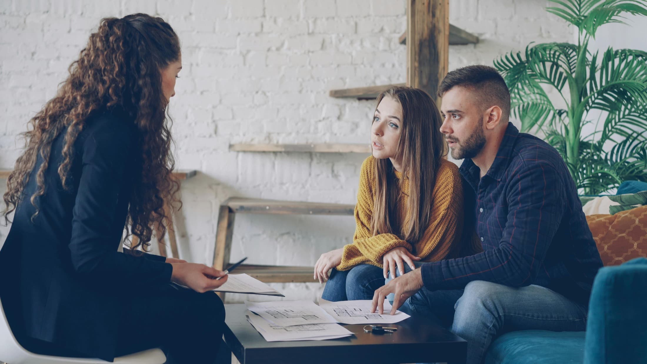 A couple reviewing plans with their advisor